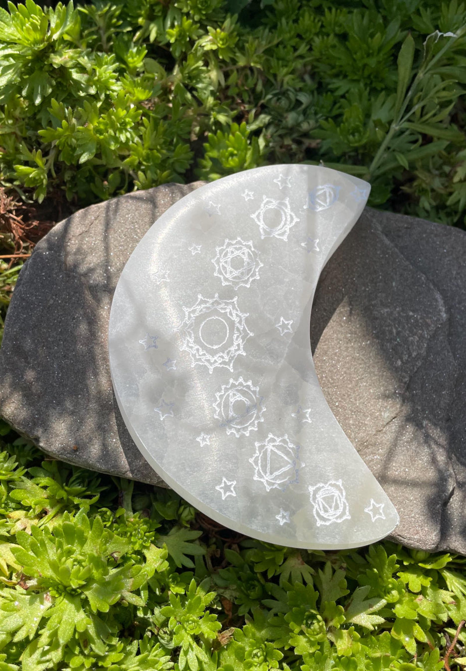 Etched Selenite Crystal Plate in the shape of a crescent moon.